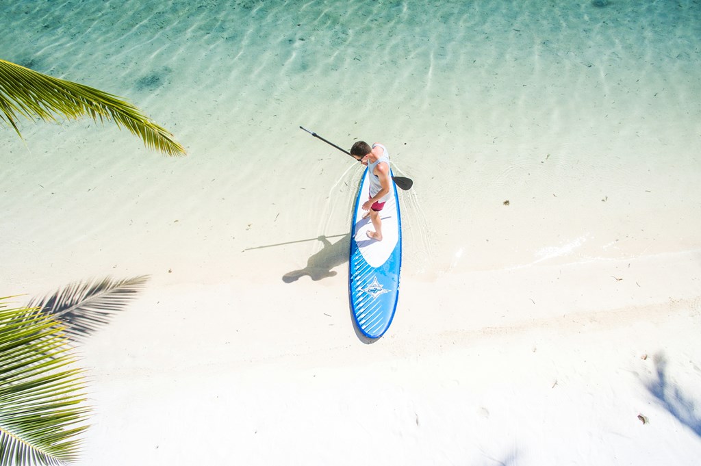 A man on paddleboard in the sea